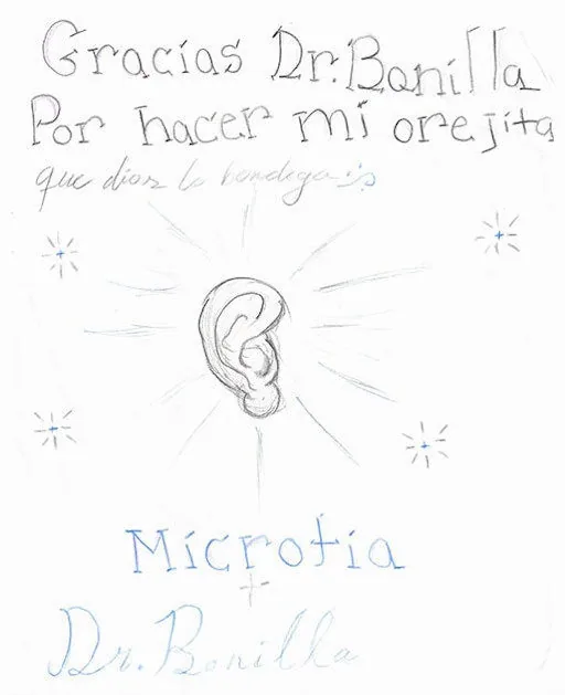 Dibujo a lápiz y en colores de una oreja resplandeciente, con la inscripción en español «Gracias Dr. Bonilla por hacer mi orejita que Dios lo bendiga» y las palabras Microtia y Dr. Bonilla: un regalo de agradecimiento profundamente espiritual en español al Dr. Arturo Bonilla de un paciente agradecido que se sometió a cirugía de microtia